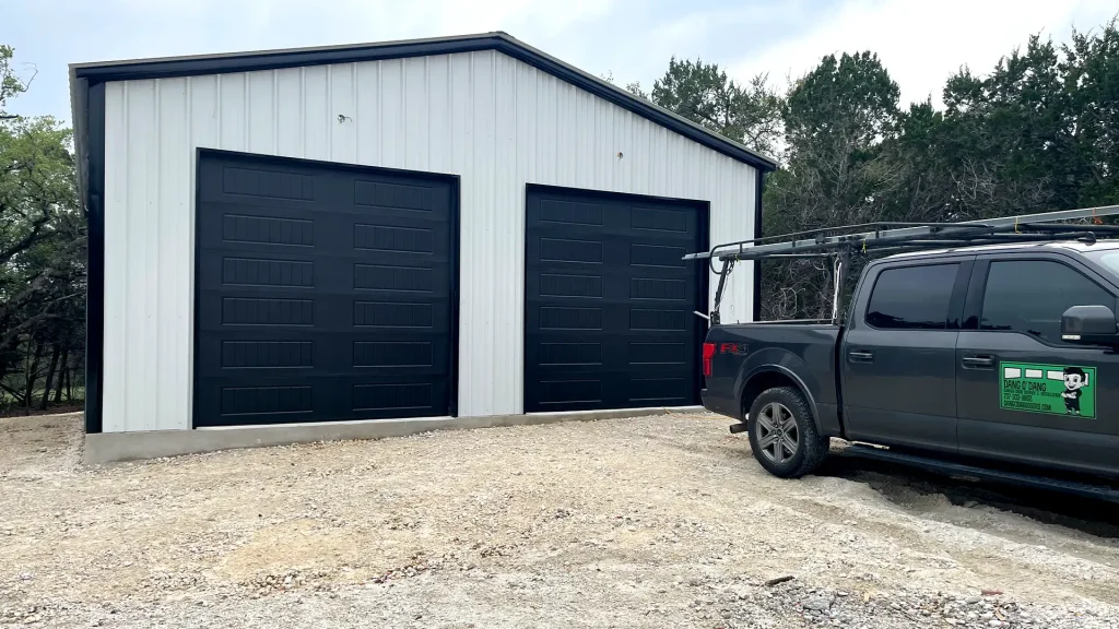 two black panelled garage doors